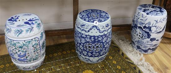An early 20th Chinese blue and white garden seat and two other later examples